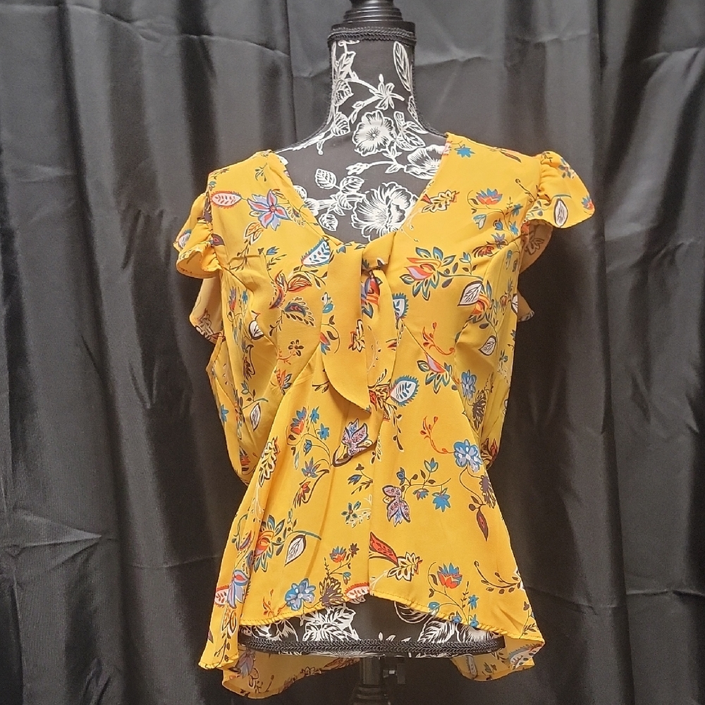 Beautiful springtime gold blouse with blue flowers